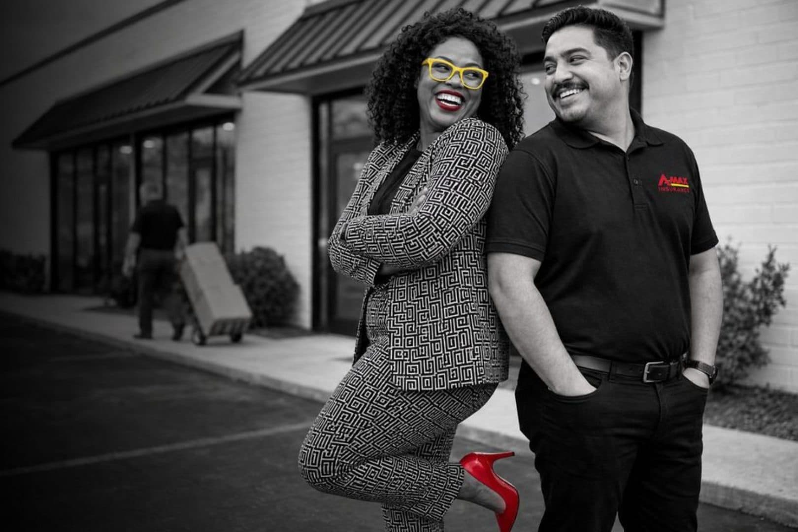 A business owner and an A-MAX agent outside her storefront