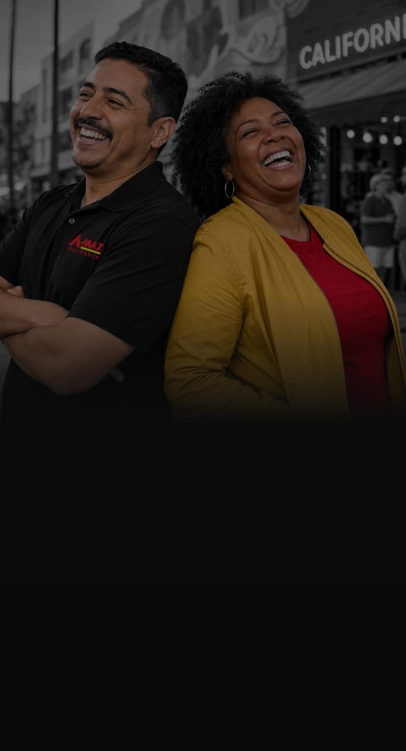 An A-MAX agent and a customer smiling on a California street