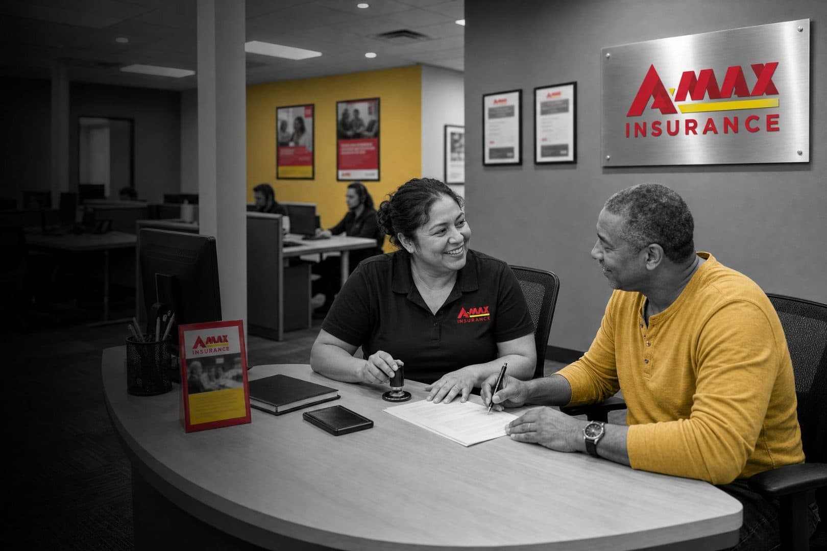 An A-MAX agent notarizing a document for a customer at an office desk