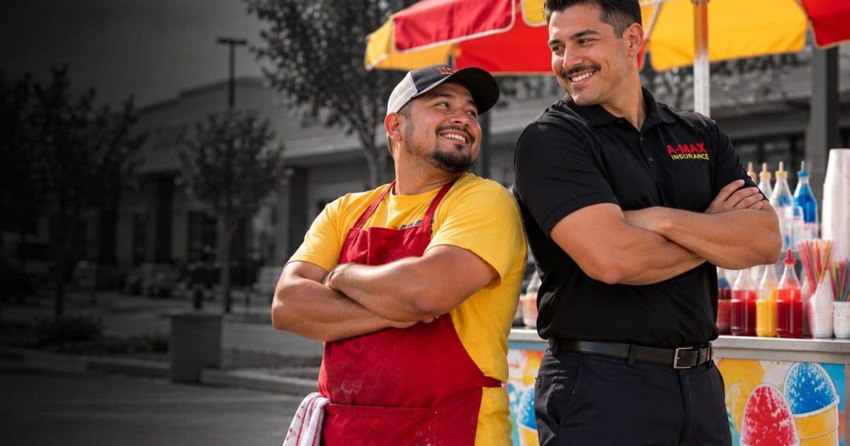 A food vendor and an A-MAX agent smiling beside a street food cart